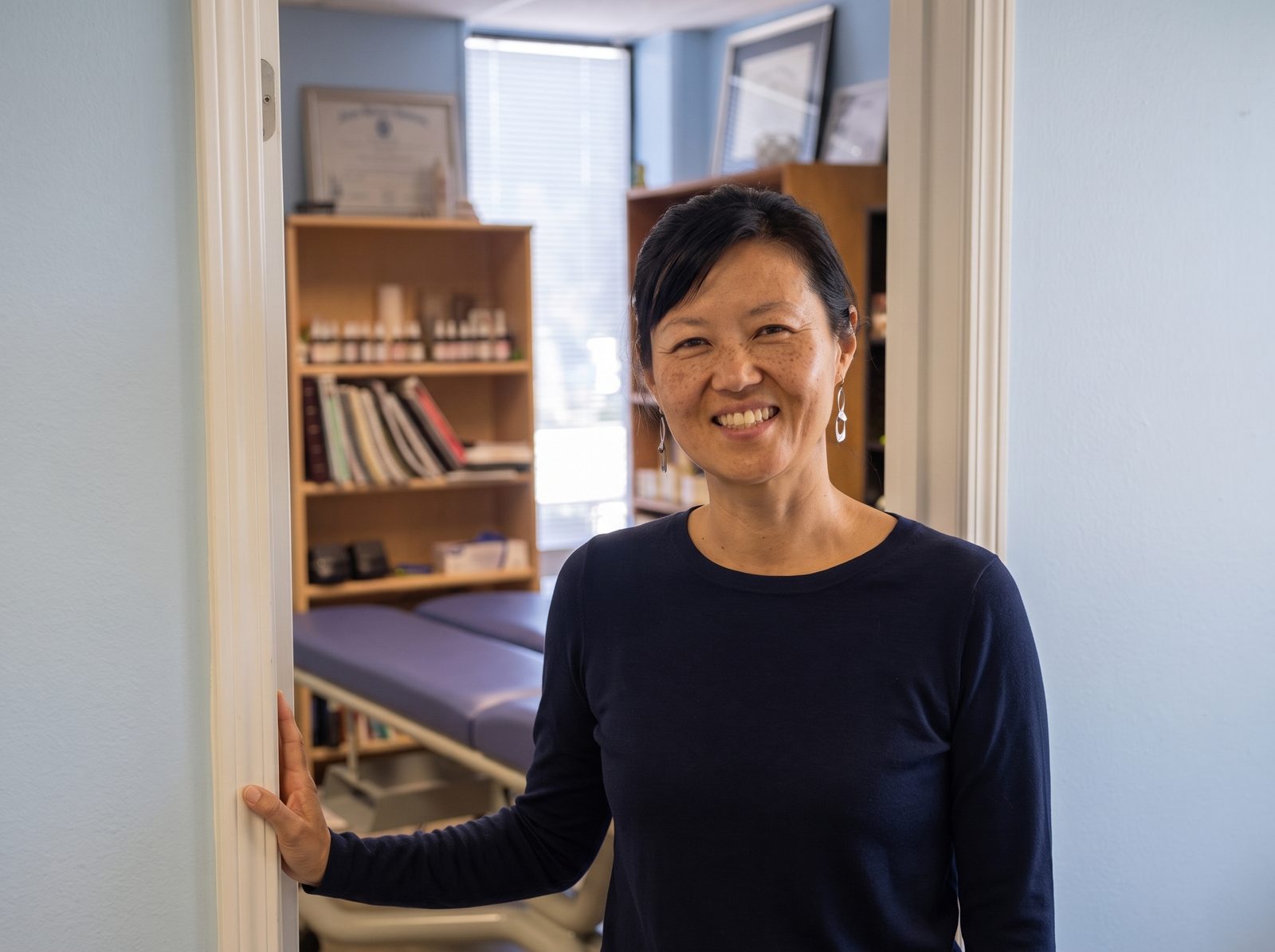 Dr. Helen Bae Mankoski, D.C., in the doorway of her Sunnyvale suite