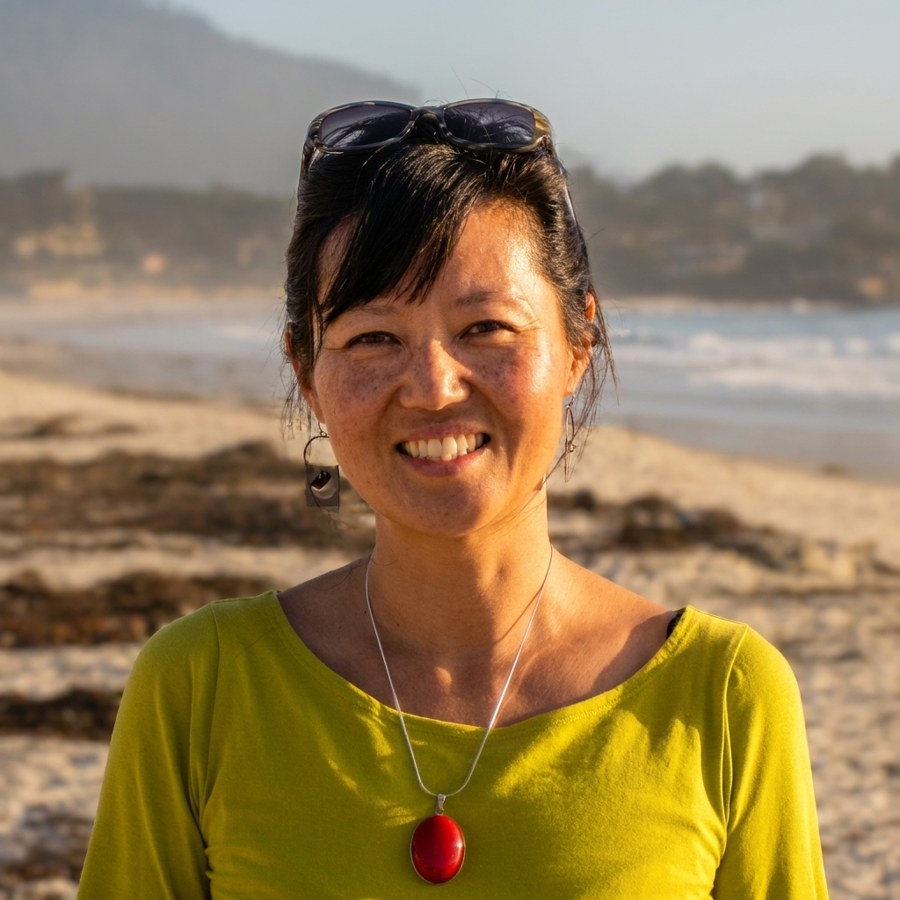 Dr. Helen Bae Mankoski, D.C., on the beach at Carmel